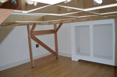 Picture of Room 1 baseboard, legs from below